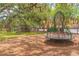 Community playground featuring a merry-go-round, climbing structure, and a grassy lawn at 516 7Th Se St, Largo, FL 33771