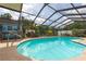 Tranquil screened-in pool with a view of the landscaped backyard and gazebo at 516 7Th Se St, Largo, FL 33771