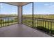 Balcony featuring lush greenery and city views at 5430 Eagles Point Cir # 202, Sarasota, FL 34231