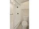 Clean bathroom featuring a frameless shower with tiled walls and modern fixtures at 5430 Eagles Point Cir # 202, Sarasota, FL 34231