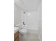 Bathroom with a combined shower and tub featuring white tile and modern fixtures at 5430 Eagles Point Cir # 202, Sarasota, FL 34231