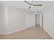 Bedroom featuring neutral flooring, base trim and a ceiling fan at 5430 Eagles Point Cir # 202, Sarasota, FL 34231