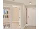 Entryway view of a bright space featuring French doors at 5430 Eagles Point Cir # 202, Sarasota, FL 34231