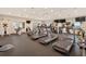 Bright fitness center equipped with treadmills and various exercise machines at 5430 Eagles Point Cir # 202, Sarasota, FL 34231