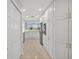 Bright, spacious kitchen with white cabinets, marble counters, stainless steel appliances, and a view at 5430 Eagles Point Cir # 202, Sarasota, FL 34231