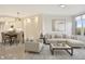 Stylish living and dining area with contemporary furniture, neutral tones, and modern lighting at 5430 Eagles Point Cir # 202, Sarasota, FL 34231