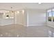 Bright, open-concept space with neutral walls and floors, and a modern kitchen in view at 5430 Eagles Point Cir # 202, Sarasota, FL 34231