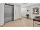 Building lobby featuring tile floors, lift access and stylish decorative elements at 5430 Eagles Point Cir # 202, Sarasota, FL 34231