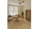 Office with a light-colored chair and desk, along with shelving and a plant at 5430 Eagles Point Cir # 202, Sarasota, FL 34231