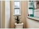 Cozy bathroom featuring decorative art and a plant adding a touch of green to the room at 5726 20Th N Ave, St Petersburg, FL 33710
