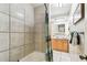 Bathroom featuring a shower/tub combo with tile surround and a wood vanity at 5726 20Th N Ave, St Petersburg, FL 33710