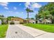Charming single-story home with a well-maintained lawn, long driveway and stone accents at 5726 20Th N Ave, St Petersburg, FL 33710