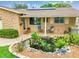 Inviting front porch with seating, and a charming pond feature at 5726 20Th N Ave, St Petersburg, FL 33710