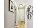 Hallway featuring travertine floors, neutral paint, and decorative accents at 5726 20Th N Ave, St Petersburg, FL 33710