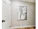 Neutral hallway with modern artwork and paneled door at 5726 20Th N Ave, St Petersburg, FL 33710