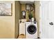 Compact laundry area featuring a sink, washer, and dryer for added convenience at 5726 20Th N Ave, St Petersburg, FL 33710