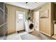 Well-equipped laundry room with washer, dryer, and backyard access at 5726 20Th N Ave, St Petersburg, FL 33710