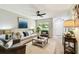 Open-concept living room with neutral tones, comfortable seating, and ample light at 5726 20Th N Ave, St Petersburg, FL 33710