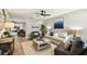 Bright living room featuring stylish furniture, tiled floors and a ceiling fan at 5726 20Th N Ave, St Petersburg, FL 33710