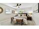 Cozy bedroom with a decorative ceiling fan, a bench, and natural light at 5726 20Th N Ave, St Petersburg, FL 33710