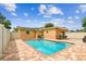 A refreshing pool with brick pavers, sunny skies, and blue water. Relax and enjoy your backyard oasis! at 5726 20Th N Ave, St Petersburg, FL 33710