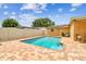 Refreshing backyard swimming pool surrounded by a brick patio, offering a private outdoor oasis for relaxation at 5726 20Th N Ave, St Petersburg, FL 33710
