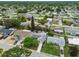 Aerial view showcases this home's mature landscaping, proximity to other residences, and neighborhood features at 5744 Thrush Dr, New Port Richey, FL 34652