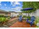 Inviting backyard with lounge seating, manicured landscaping, and a serene atmosphere at 5744 Thrush Dr, New Port Richey, FL 34652