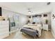 Bright bedroom with a ceiling fan, lots of natural light and matching dressers at 5744 Thrush Dr, New Port Richey, FL 34652