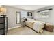 Cozy bedroom with carpet flooring, a cow painting and lots of natural light at 5744 Thrush Dr, New Port Richey, FL 34652