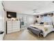 Bright bedroom with a ceiling fan, lots of natural light and matching dressers at 5744 Thrush Dr, New Port Richey, FL 34652
