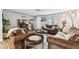 Cozy living room featuring comfortable seating, neutral decor, and an inviting atmosphere for relaxation at 5744 Thrush Dr, New Port Richey, FL 34652