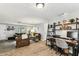 Open-concept living space featuring a functional office area with ample storage and stylish decor at 5744 Thrush Dr, New Port Richey, FL 34652