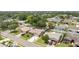 Aerial view of a neighborhood showcasing well-maintained homes and tree-lined streets at 6289 107Th N Ave, Pinellas Park, FL 33782