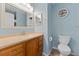 Clean bathroom featuring a sink vanity, toilet, and ample lighting at 6289 107Th N Ave, Pinellas Park, FL 33782