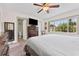 Bedroom features a window view, dresser, and access to a private bathroom at 6289 107Th N Ave, Pinellas Park, FL 33782