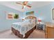 Tranquil bedroom with ceiling fan and a sun-filled window view at 6289 107Th N Ave, Pinellas Park, FL 33782