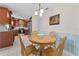 Cozy dining area featuring a wooden table with chairs, and a view of the kitchen at 6289 107Th N Ave, Pinellas Park, FL 33782