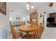 Dining area featuring a wooden table with chairs, and a view of the living room at 6289 107Th N Ave, Pinellas Park, FL 33782