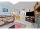 Spacious living area with tile flooring, a cozy couch, and seamless flow to dining at 6289 107Th N Ave, Pinellas Park, FL 33782