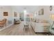 Cozy living room with wood-look floors, neutral tones, and a skylight for natural light at 6289 107Th N Ave, Pinellas Park, FL 33782