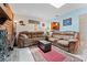 Inviting living room with plush leather seating and a view into the kitchen at 6289 107Th N Ave, Pinellas Park, FL 33782
