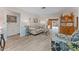 Bright living room boasting wood-look floors, neutral paint, and a view to the pool at 6289 107Th N Ave, Pinellas Park, FL 33782