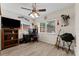 Office with tile floor, fan, desk, and large screen TV at 6289 107Th N Ave, Pinellas Park, FL 33782
