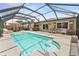 Inviting outdoor pool area with screened enclosure and patio seating at 6289 107Th N Ave, Pinellas Park, FL 33782