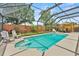 Sparkling pool with screened enclosure and patio seating at 6289 107Th N Ave, Pinellas Park, FL 33782
