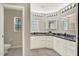 Bathroom with marble countertops, plenty of cabinet space and great lighting at 6439 Gentle Ben Cir, Wesley Chapel, FL 33544
