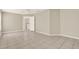 Spacious bedroom featuring tile flooring, neutral paint, and natural light at 6439 Gentle Ben Cir, Wesley Chapel, FL 33544