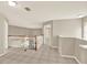 Upstairs hallway featuring tile flooring, wood and white banister, and neutral paint at 6439 Gentle Ben Cir, Wesley Chapel, FL 33544