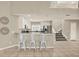 Bright kitchen featuring granite countertops, stainless steel appliances, and barstool seating at 6439 Gentle Ben Cir, Wesley Chapel, FL 33544